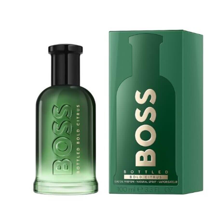 Flacone di vetro verde trasparente con tappo nero e confezione verde
